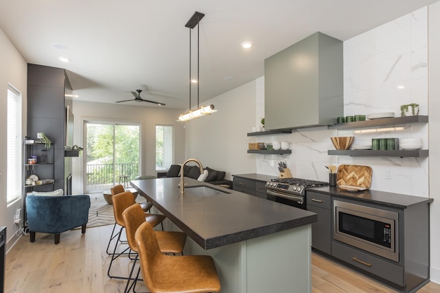 408D Moore Ave, Nashville, TN 37203 - kitchen with a sink, open shelves, stainless steel appliances, and dark countertops