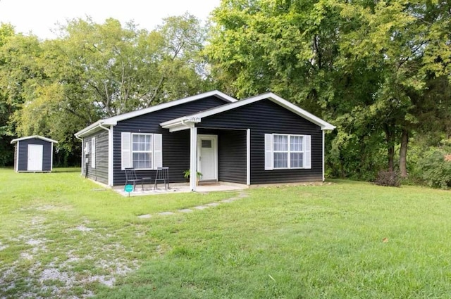 1767C W Main St, Franklin, TN 37064 - view of front facade with a front yard, a patio, and view of scattered trees