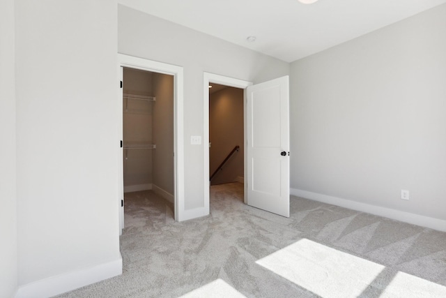107 E 9th St Unit C5, Columbia, TN 38401 - unfurnished bedroom with carpet floors, a spacious closet, baseboards, and a closet
