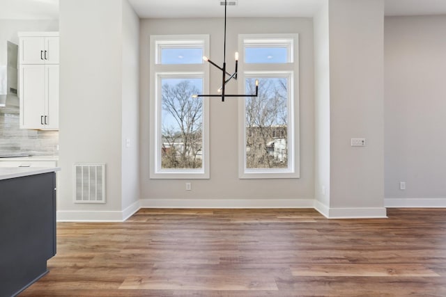 107 E 9th St Unit C5, Columbia, TN 38401 - unfurnished dining area with light wood-style floors and baseboards