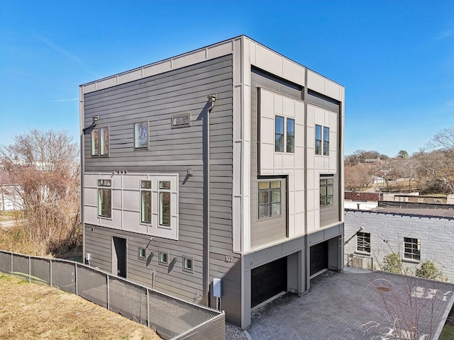 107 E 9th St Unit C5, Columbia, TN 38401 - view of property exterior featuring an attached garage and driveway
