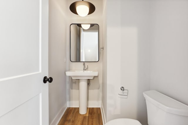 107 E 9th St Unit C5, Columbia, TN 38401 - bathroom featuring toilet, wood finished floors, and baseboards