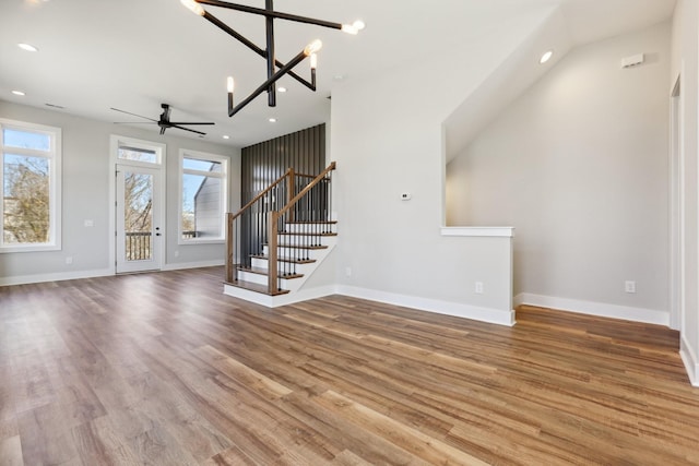 107 E 9th St Unit C5, Columbia, TN 38401 - unfurnished living room featuring a ceiling fan, stairs, wood finished floors, recessed lighting, and baseboards