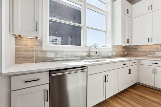 107 E 9th St Unit C5, Columbia, TN 38401 - kitchen featuring dishwasher, a sink, white cabinetry, and decorative backsplash