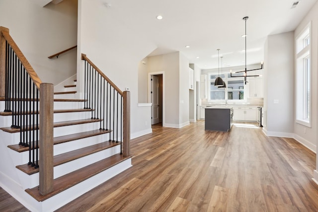 107 E 9th St Unit C5, Columbia, TN 38401 - staircase featuring wood finished floors, recessed lighting, and baseboards