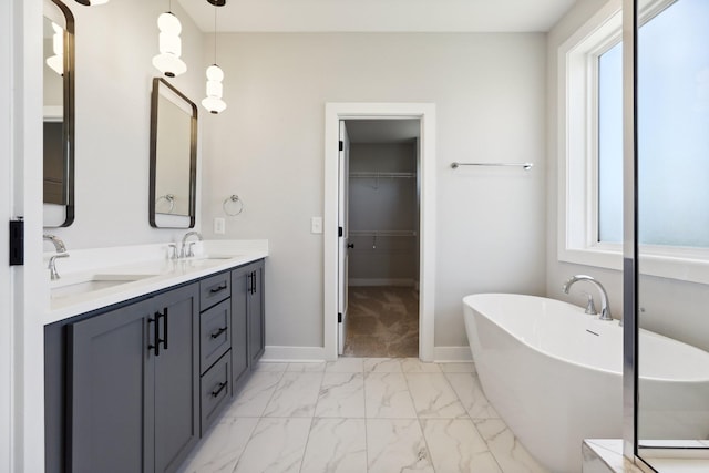 107 E 9th St Unit C5, Columbia, TN 38401 - full bath with marble look tile flooring, a freestanding bath, double vanity, and healthy amount of natural light