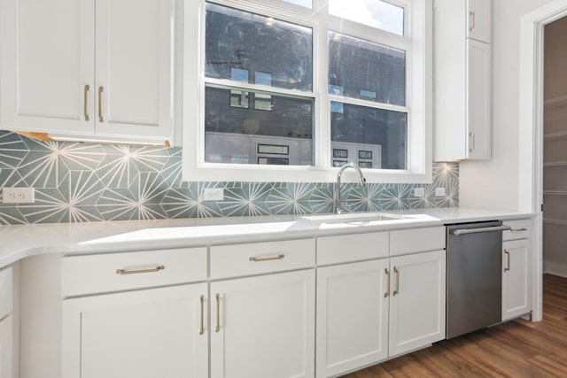 107 E 9th St Unit C6, Columbia, TN 38401 - kitchen featuring stainless steel dishwasher, a sink, white cabinets, tasteful backsplash, and light countertops