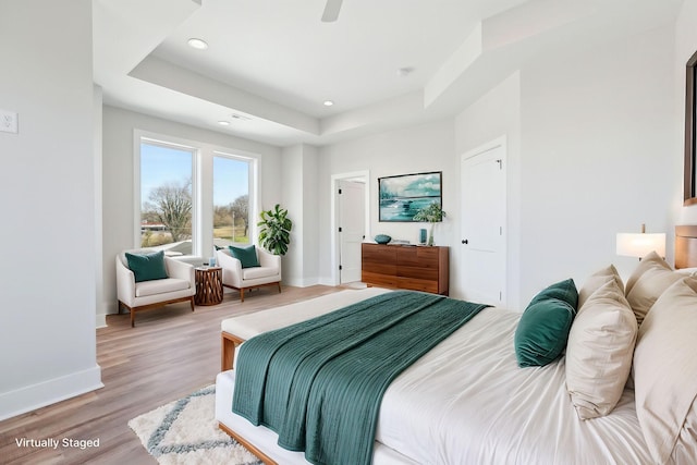 107 E 9th St Unit C6, Columbia, TN 38401 - bedroom featuring baseboards, a raised ceiling, wood finished floors, and recessed lighting