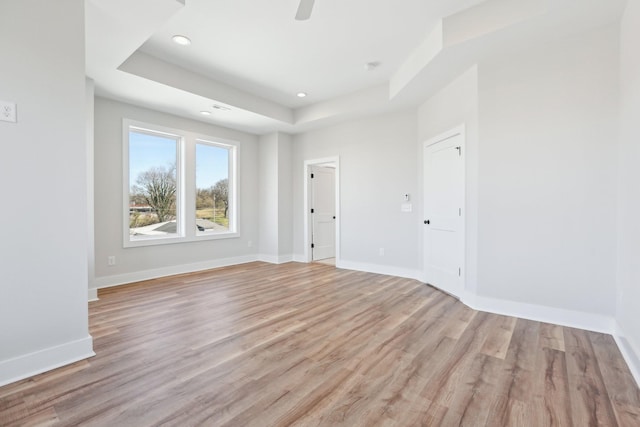 107 E 9th St Unit C6, Columbia, TN 38401 - spare room featuring a raised ceiling, light wood-type flooring, recessed lighting, baseboards, and ceiling fan