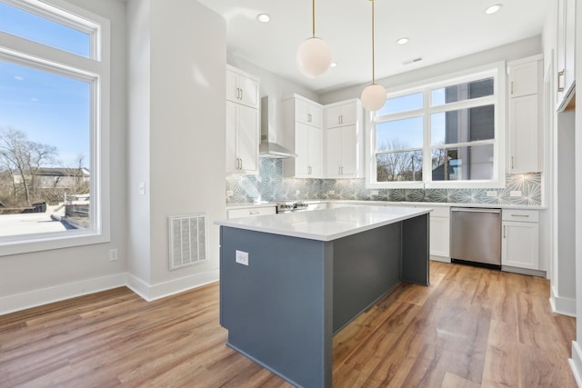 107 E 9th St Unit C6, Columbia, TN 38401 - kitchen featuring dishwasher, wall chimney range hood, backsplash, white cabinets, and recessed lighting