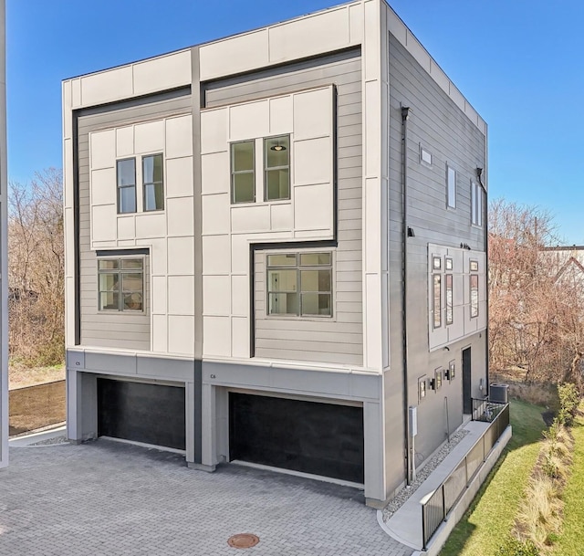 107 E 9th St Unit C6, Columbia, TN 38401 - view of side of home with an attached garage and decorative driveway