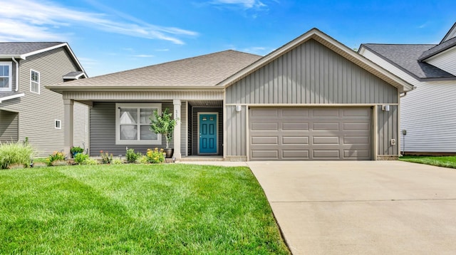 1175 Eagles Nest Ln, Clarksville, TN 37040 - view of front facade featuring a garage, board and batten siding, a front yard, concrete driveway, and covered porch