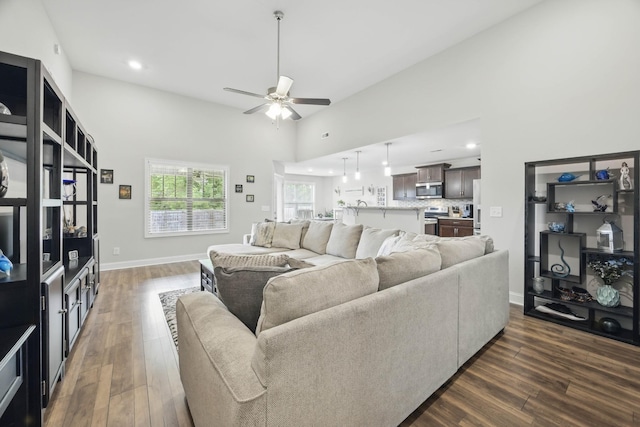 1175 Eagles Nest Ln, Clarksville, TN 37040 - living area with dark wood-style floors, a ceiling fan, recessed lighting, baseboards, and a high ceiling