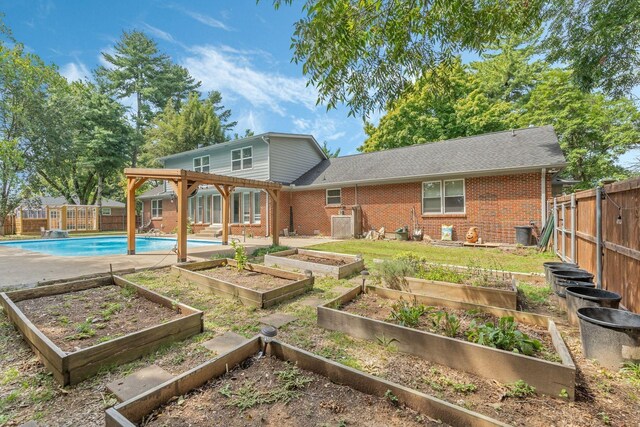 818 N Rutherford Blvd, Murfreesboro, TN 37130 - rear view of house with brick siding and a garden