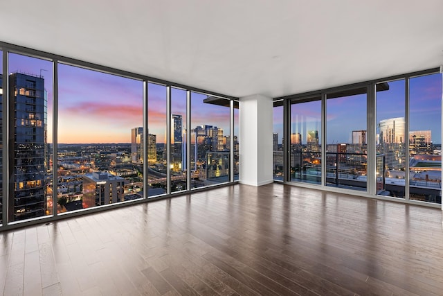 1212 Laurel St Unit 1902, Nashville, TN 37203 - spare room featuring a skyline view, floor to ceiling windows, and wood finished floors