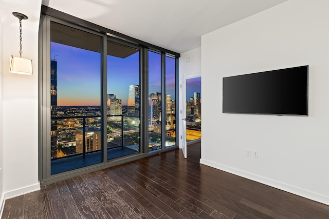 1212 Laurel St Unit 1902, Nashville, TN 37203 - unfurnished room with expansive windows, wood finished floors, and baseboards
