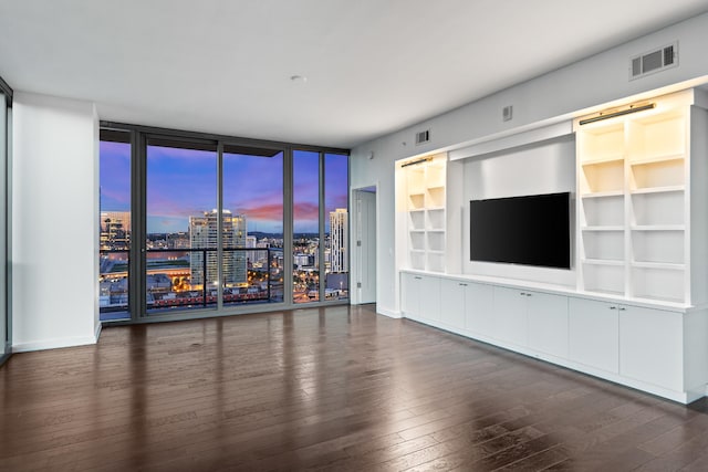 1212 Laurel St Unit 1902, Nashville, TN 37203 - unfurnished living room with wood-type flooring and a wall of windows