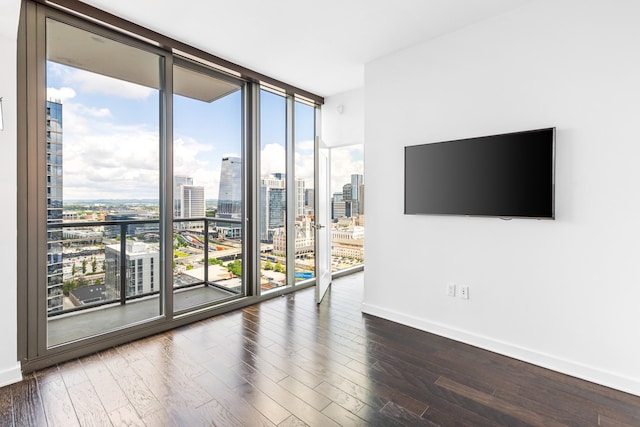 1212 Laurel St Unit 1902, Nashville, TN 37203 - unfurnished room with floor to ceiling windows, baseboards, and wood finished floors