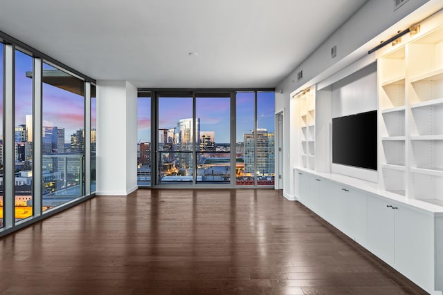 1212 Laurel St Unit 1902, Nashville, TN 37203 - unfurnished living room with hardwood / wood-style flooring and a wall of windows