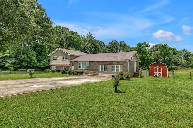 135 Carter Rd, Winchester, TN 37398 - tri-level home featuring brick siding, concrete driveway, a front yard, and metal roof
