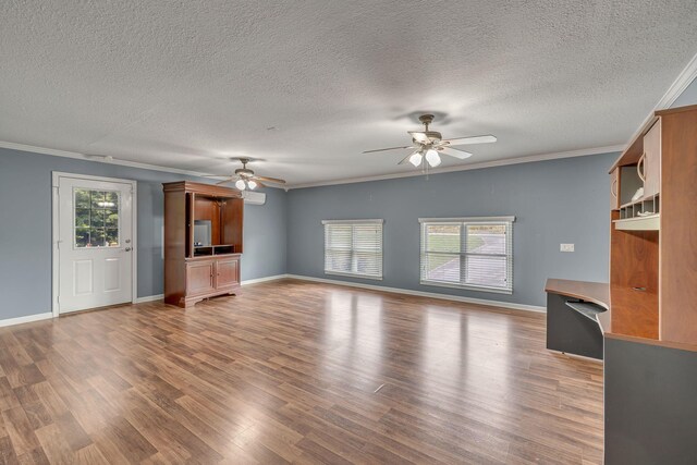 135 Carter Rd, Winchester, TN 37398 - unfurnished living room featuring ceiling fan, ornamental molding, wood finished floors, a textured ceiling, and baseboards