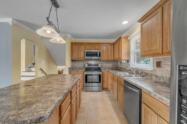 135 Carter Rd, Winchester, TN 37398 - kitchen featuring stainless steel appliances, a sink, dark countertops, backsplash, and ornamental molding