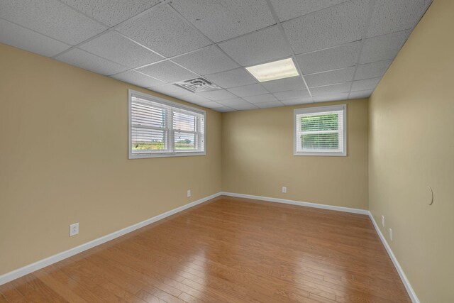 135 Carter Rd, Winchester, TN 37398 - empty room featuring a paneled ceiling, light wood-style floors, and baseboards