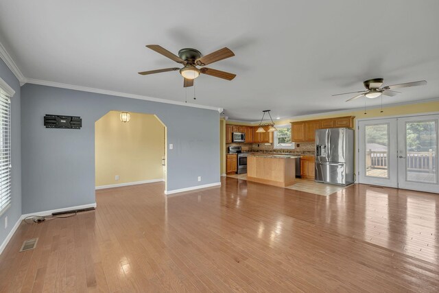 135 Carter Rd, Winchester, TN 37398 - unfurnished living room with ceiling fan, baseboards, french doors, light wood-type flooring, and ornamental molding