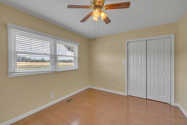 135 Carter Rd, Winchester, TN 37398 - unfurnished bedroom featuring wood finished floors, baseboards, a closet, and ceiling fan
