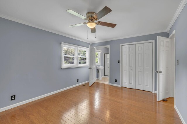 135 Carter Rd, Winchester, TN 37398 - unfurnished bedroom with baseboards, light wood-style floors, ornamental molding, a closet, and a sink