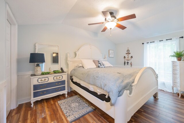 91 Creekside View Ln, Decaturville, TN 38329 - bedroom featuring lofted ceiling, dark wood-style flooring, ceiling fan, and wainscoting