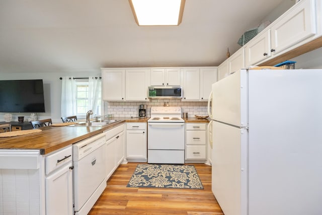 91 Creekside View Ln, Decaturville, TN 38329 - kitchen featuring white appliances, a sink, a peninsula, butcher block countertops, and white cabinets