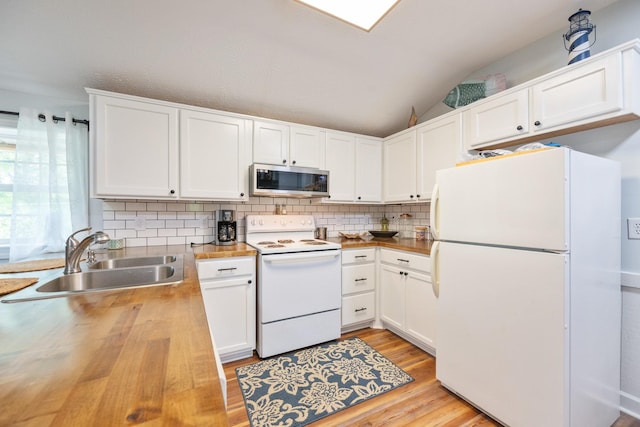 91 Creekside View Ln, Decaturville, TN 38329 - kitchen with white appliances, butcher block countertops, a sink, backsplash, and vaulted ceiling