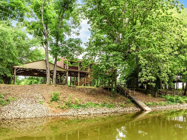 91 Creekside View Ln, Decaturville, TN 38329 - view of yard featuring stairway and a deck with water view