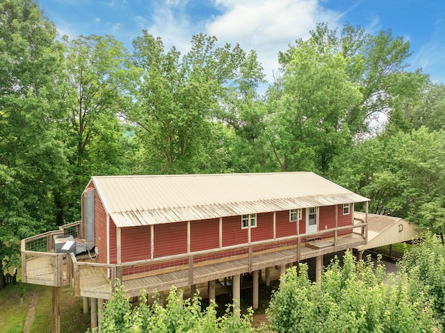 91 Creekside View Ln, Decaturville, TN 38329 - rear view of property with metal roof and a deck