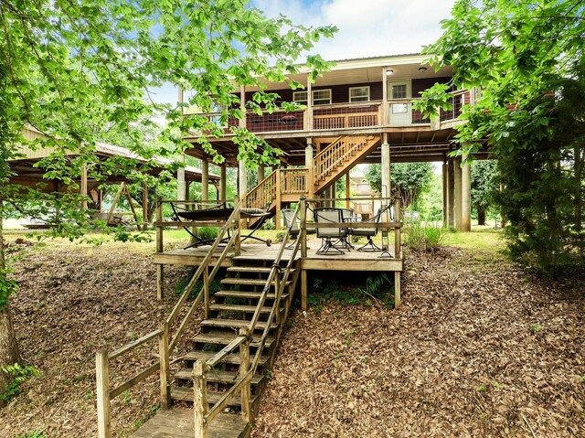 91 Creekside View Ln, Decaturville, TN 38329 - view of jungle gym featuring stairway and a wooden deck