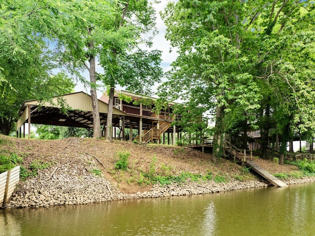 91 Creekside View Ln, Decaturville, TN 38329 - back of property with stairway and a deck with water view