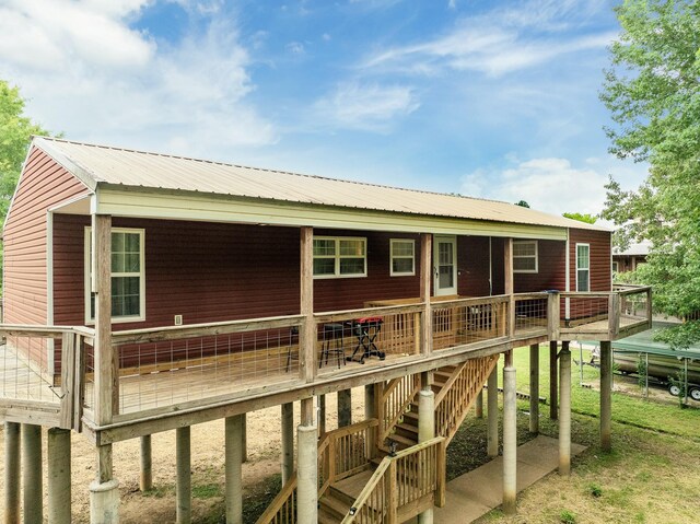 91 Creekside View Ln, Decaturville, TN 38329 - back of property with metal roof and stairs