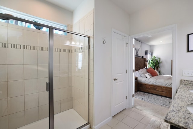 2844 Bluestem Ln, Murfreesboro, TN 37128 - ensuite bathroom with a stall shower, tile patterned flooring, vanity, and baseboards