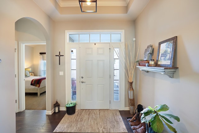 2844 Bluestem Ln, Murfreesboro, TN 37128 - entrance foyer featuring dark wood-style flooring, arched walkways, baseboards, and a tray ceiling