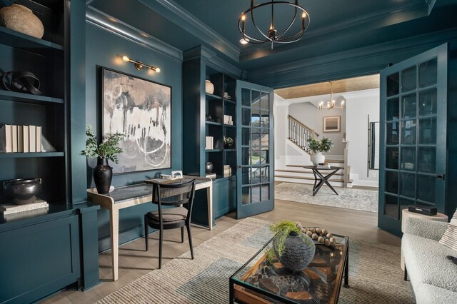 7286 Murrel Dr, Franklin, TN 37064 - office space with a chandelier, ornamental molding, light wood-style floors, built in shelves, and french doors