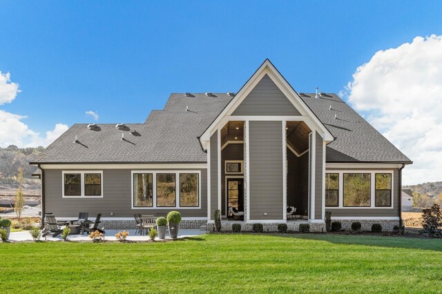 7286 Murrel Dr, Franklin, TN 37064 - back of property featuring a patio, a lawn, and a shingled roof
