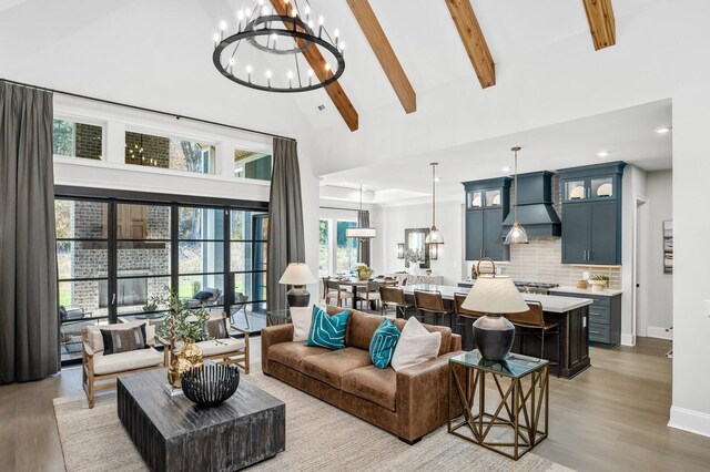 7286 Murrel Dr, Franklin, TN 37064 - living area with high vaulted ceiling, a chandelier, light wood-type flooring, beam ceiling, and plenty of natural light