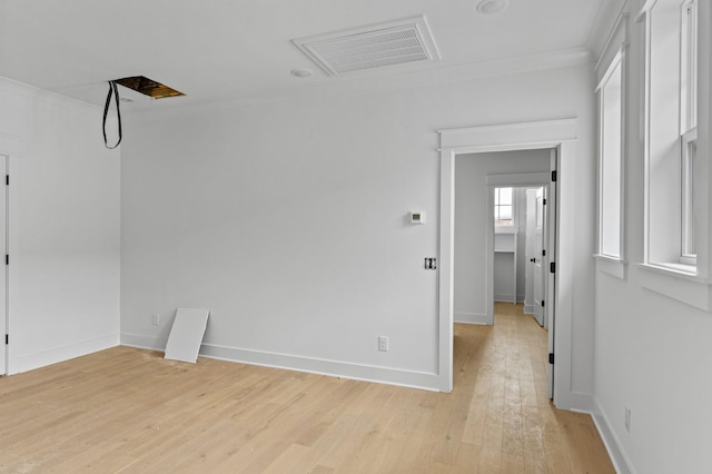 1712 Carvell Ave, Nashville, TN 37203 - spare room with light wood finished floors, crown molding, and baseboards