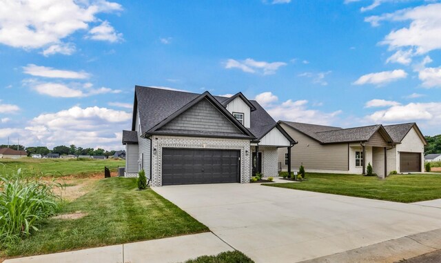 752 Boreal Way, Clarksville, TN 37042 - view of front of property with an attached garage, a front lawn, concrete driveway, brick siding, and roof with shingles