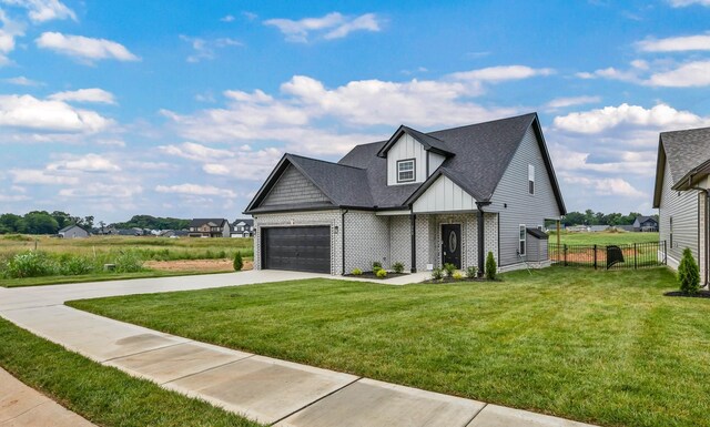 752 Boreal Way, Clarksville, TN 37042 - modern farmhouse featuring board and batten siding, concrete driveway, roof with shingles, a garage, and brick siding