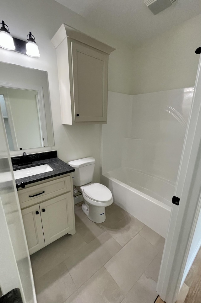 54 Union Hill Rd, Loretto, TN 38469 - bathroom featuring toilet, vanity,  shower combination, and tile patterned floors