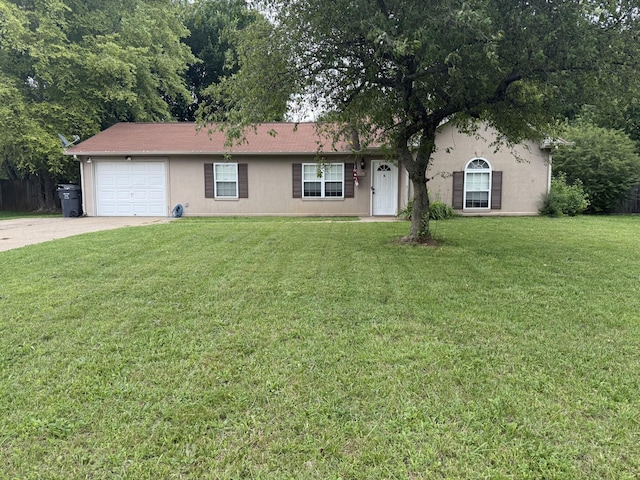 1158 Patton Pl, Oak Grove, KY 42262 - view of front of house featuring an attached garage, concrete driveway, a front yard, and stucco siding