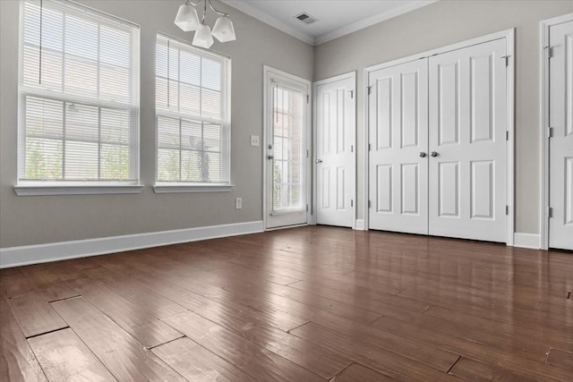4316 Summercrest Blvd Unit 105, Antioch, TN 37013 - foyer with ornamental molding, healthy amount of natural light, a chandelier, baseboards, and dark wood finished floors