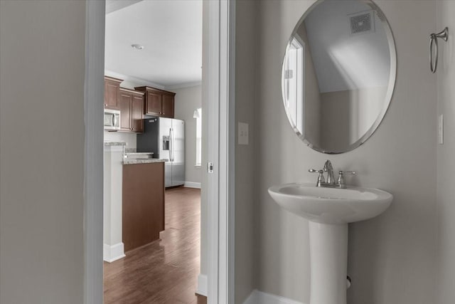 4316 Summercrest Blvd Unit 105, Antioch, TN 37013 - bathroom with wood finished floors, baseboards, ornamental molding, and a sink